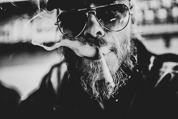 biker with sun glasses smoking a cigarette