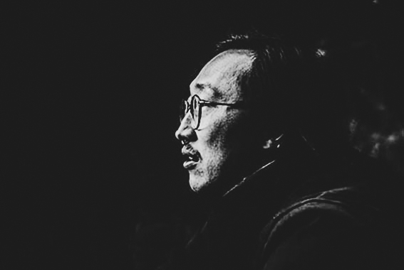 profile picture of a biker from left side, wearing glasses