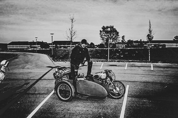 biker standing on a motorcycle