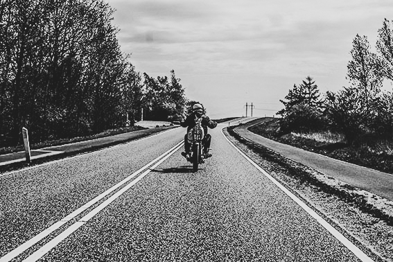 biker rading a motorcycle in the country side