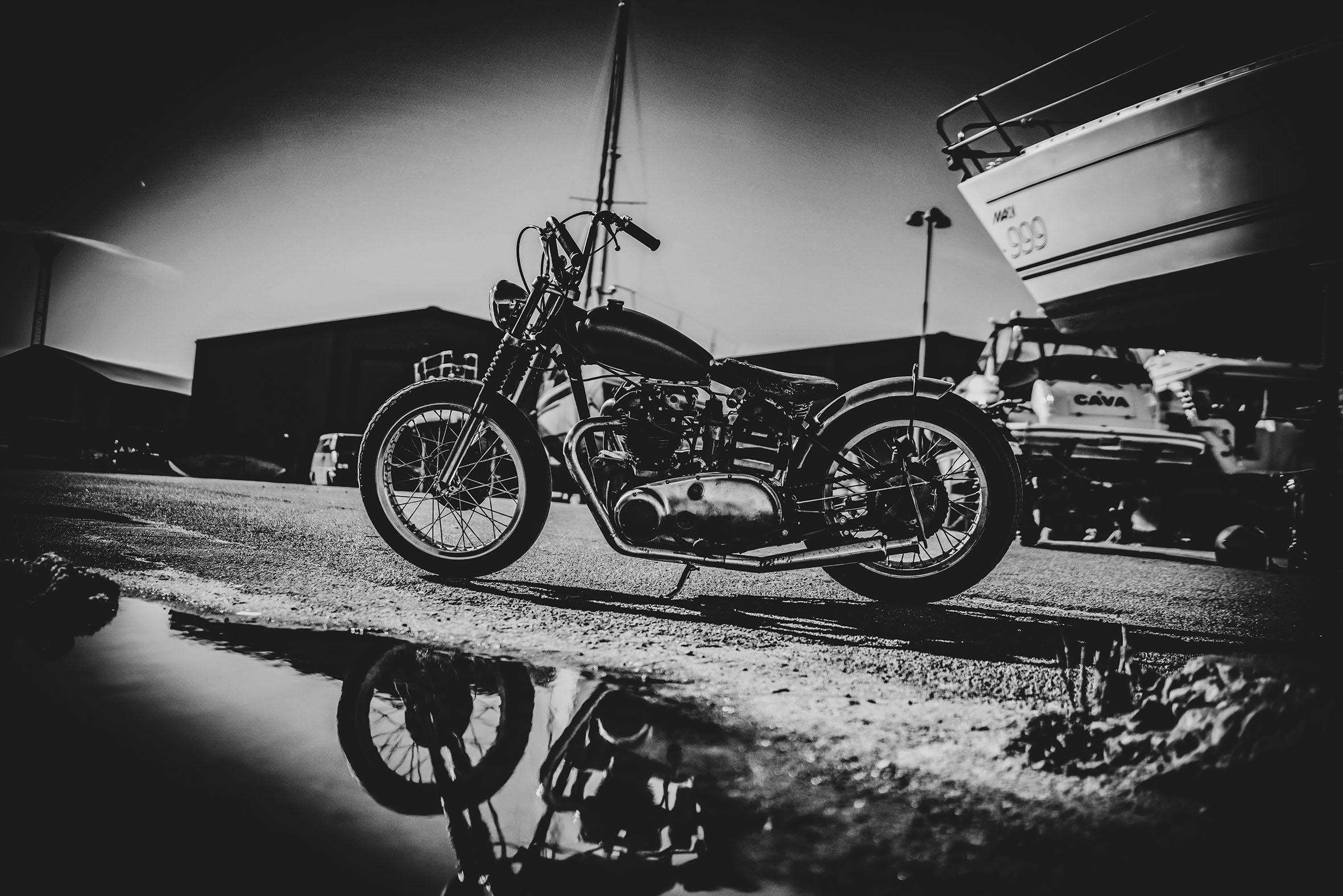 Thriumph thunderbird 6t stadning next the the boats